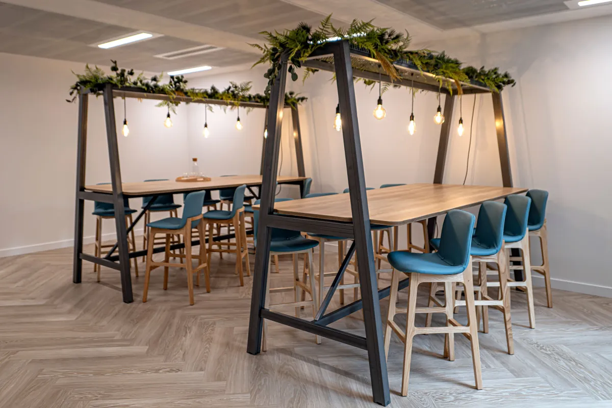 Cat B fitted floor with a long table and breakout seating
