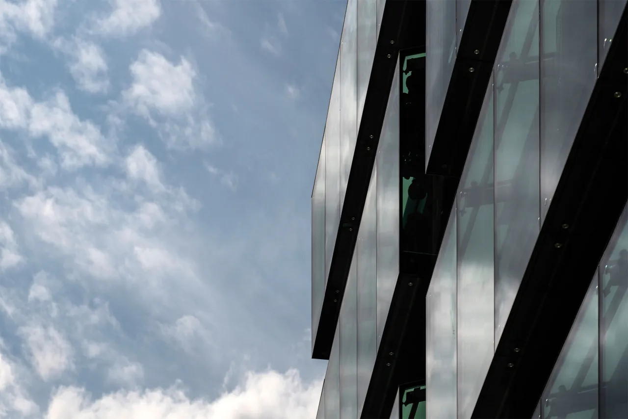 Looking up the glass facade of 10 Old Bailey into the sky